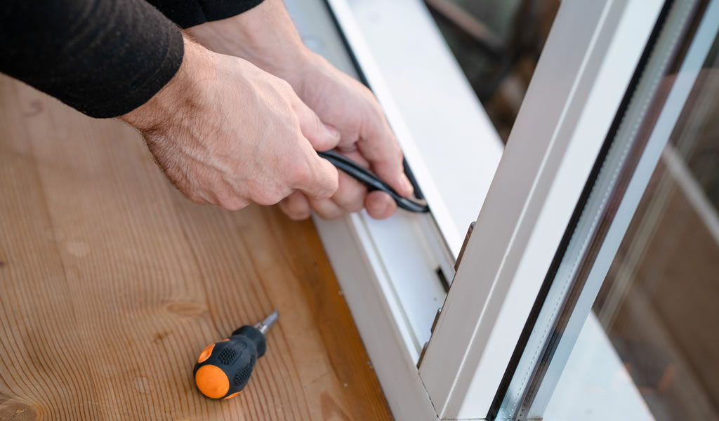 Professional repair windows, changes rubber seal gasket in pvc window
